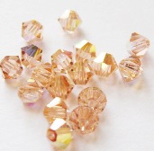 Бусина Swarovski арт.5301 биконус, размер 4 мм, цвет Light Peach AB